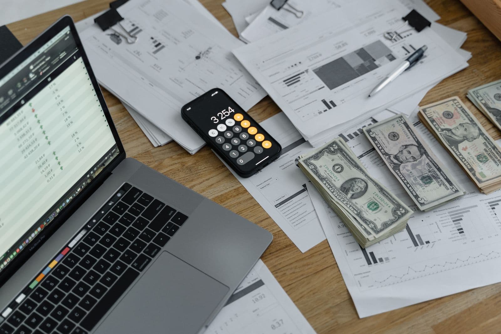 An accountant reviewing superannuation fund statements at a desk